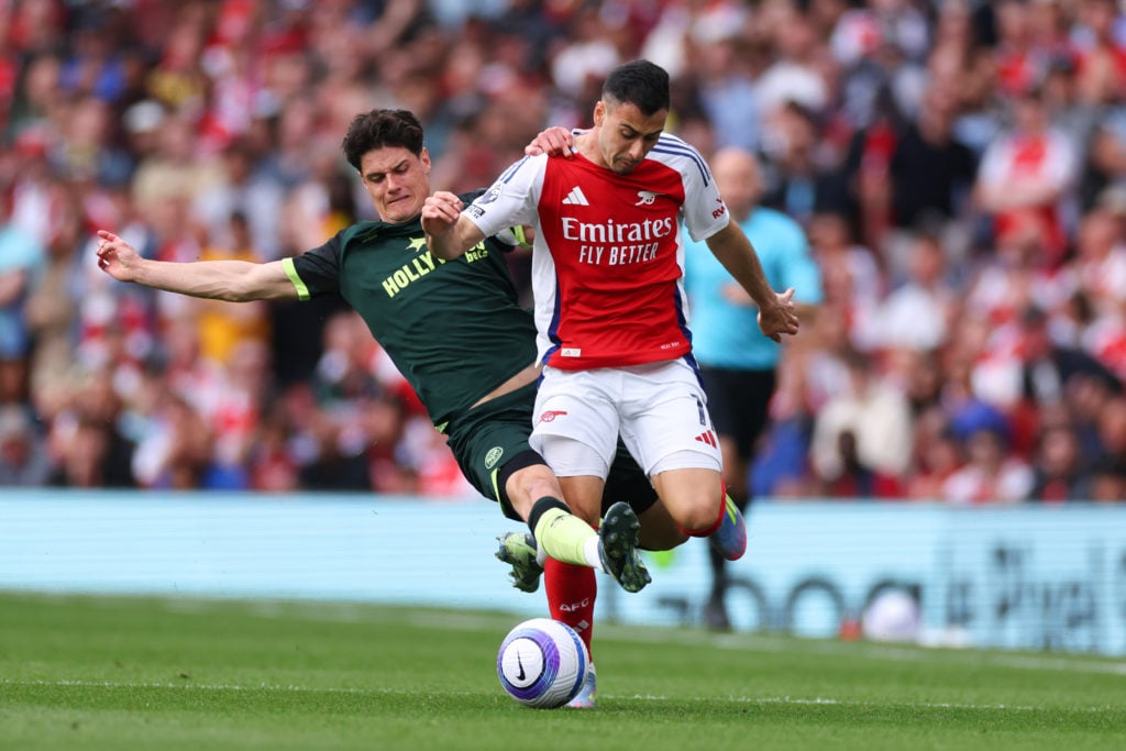 Christian Norgaard tackles Gabriel Martinelli in a match between Arsenal vs Brentford