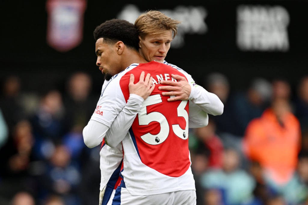 Martin Odegaard and Ethan Nwaneri embrace during Ipswich Town FC v Arsenal FC in the Premier League clash.