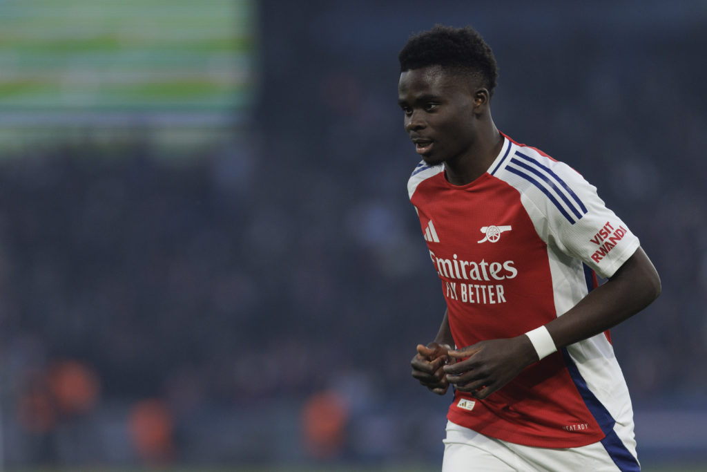 Bukayo Saka looks on during PSG vs Arsenal