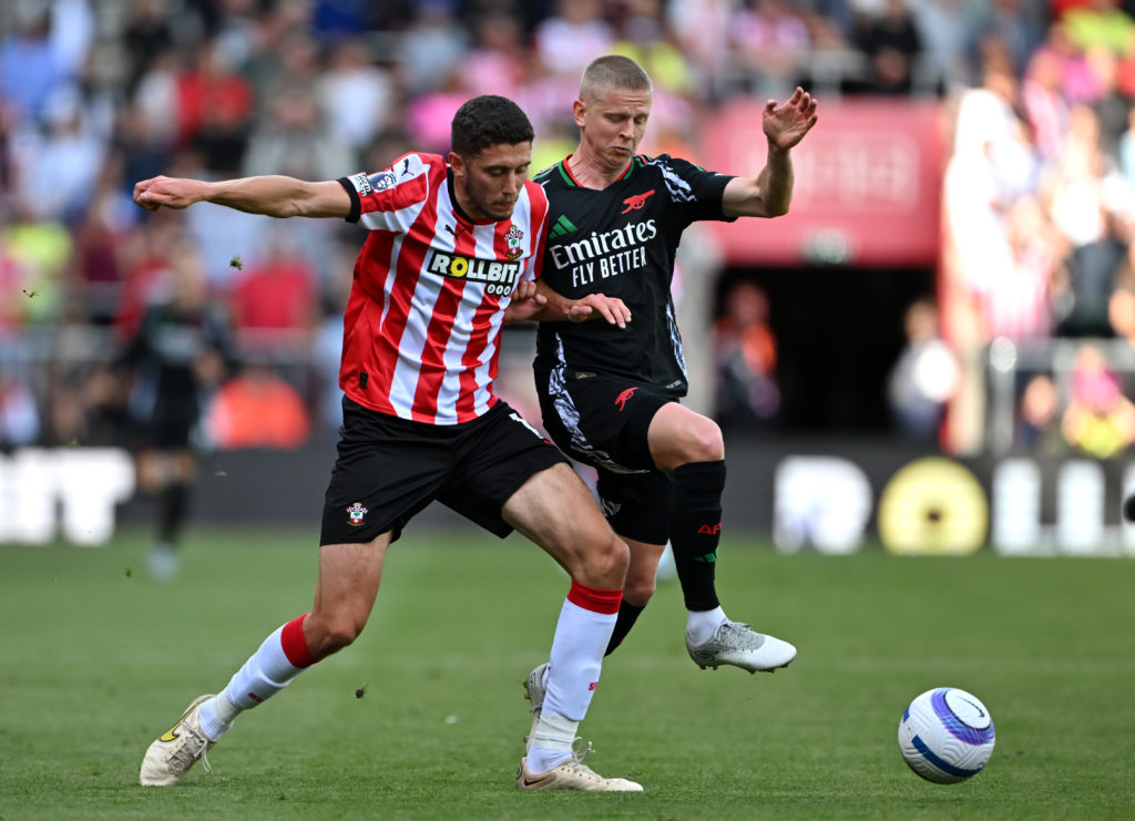 Oleksandr Zinchenko challenges Ross Stewart during Southampton FC v Arsenal FC in the Premier League clash.