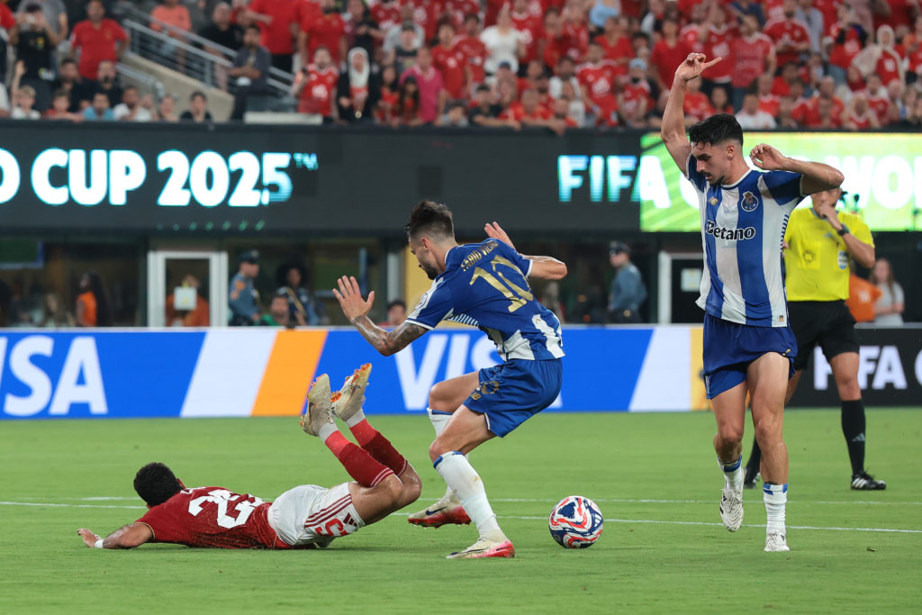 Fabio Vieira trips Zizo of Al Ahly in the box during Porto's game in the Club World Cup.