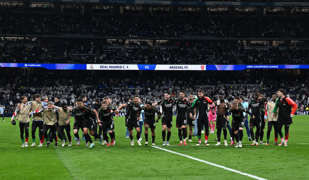 Arsenal players including William Saliba celebrate after beating Real Madrid