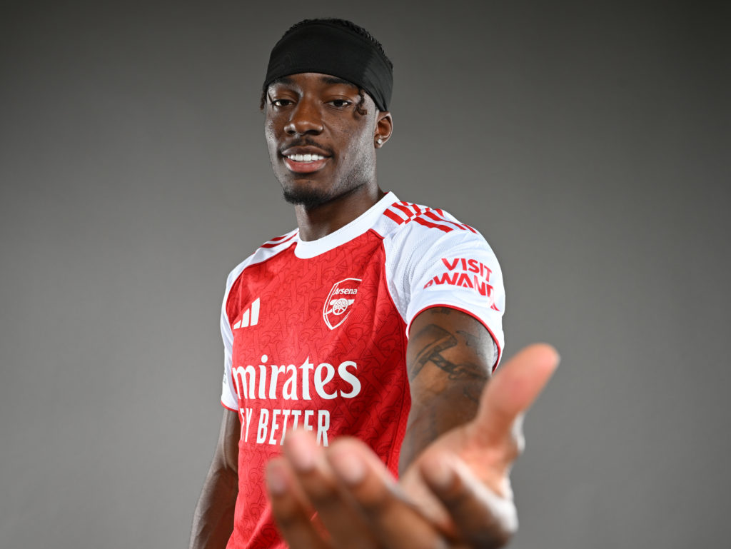 Noni Madueke poses for a photo after signing for Arsenal.
