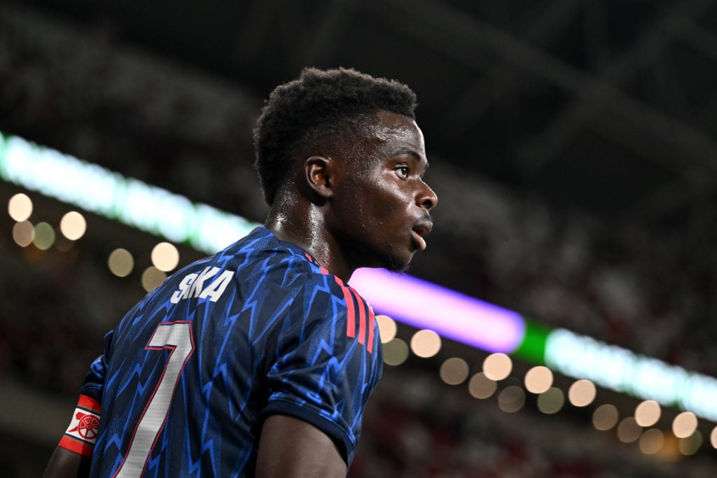 Bukayo Saka looking on during Arsenal's pre-season game against AC Milan