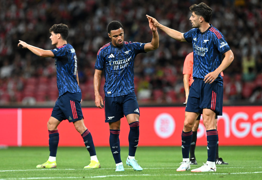 Ethan Nwaneri and Kai Havertz slapping hands during an Arsenal game