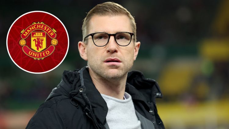 Image of Per Mertesacker looks on prior to the international friendly match between Austria and Germany, inset of A detailed view of the badge of M...