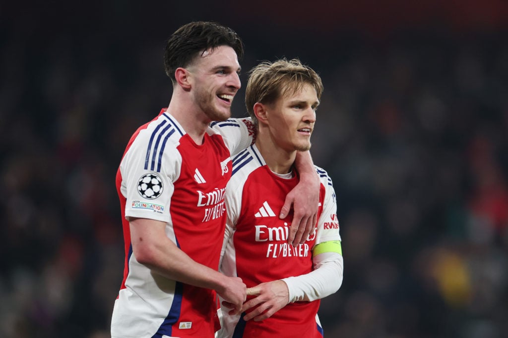 Martin Odegaard of Arsenal celebrates scoring his team's third goal with teammate Declan Rice during the UEFA Champions League 2024/25 League Phase MD7 match between Arsenal FC and GNK Dinamo at Emirates Stadium on January 22, 2025