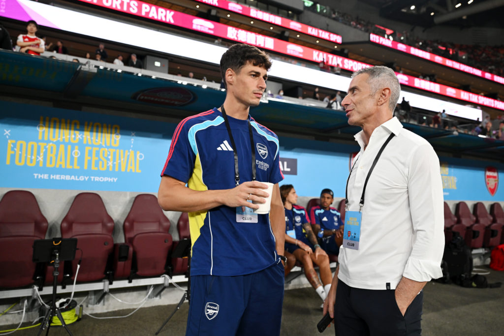Kepa Arrizabalaga speaks to Andrea Berta before an Arsenal game