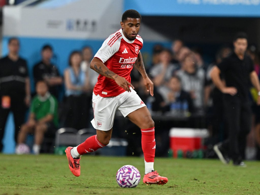 Reiss Nelson dribbles forward with the ball during Arsenal's game against Tottenham in Hong Kong.
