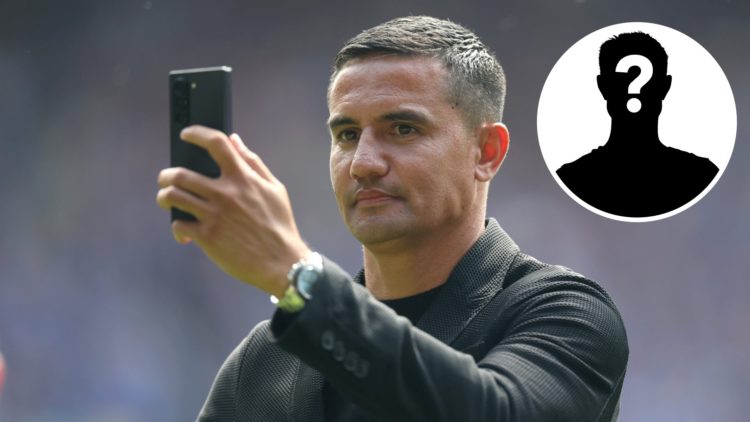 Former Everton footballer Tim Cahill holds up his phone during a lap of honour following the Premier League match between Everton FC and Southampto...