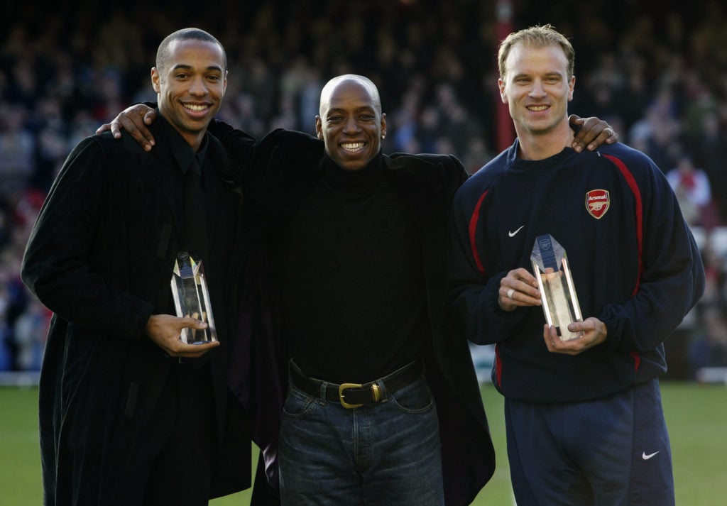 Thierry Henry and Dennis Bergkamp of Arsenal with ex-Arsenal player Ian Wright