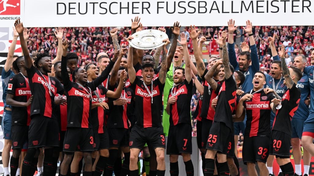 Piero Hincapie of Bayer 04 Leverkusen with the Bundesliga Meisterschale ( Bayer 04 Leverkusen coach , Edmond Tapsoba, Arthur, Patrik Schick, goalkeeper Matej Kovar, Noah Mbamba, Nathan Tella, Alejandro Grimaldo, Amine Adli, Victor Boniface, Adam Hlozek, Timothy Fosu Mensah, Exequiel Palacios, goalkeeper Patrick Pentz, Jeremie Frimpong, Madi Monamay, Gustavo Puerta , Granit FC Augsburg at DE Bay Arena on May 18, 2024