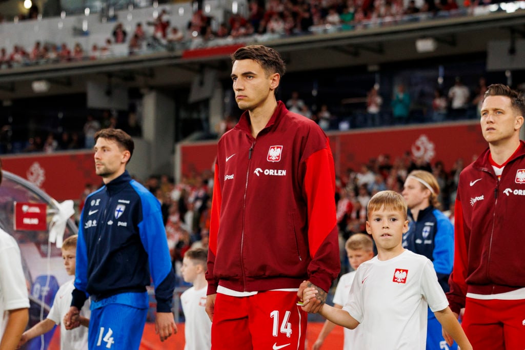 Jakub Kiwior of Poland getting into the field prior to the FIFA World Cup 2026 qualifier match between Poland and Finland.