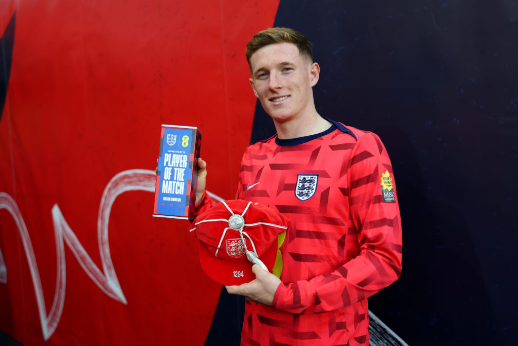 Elliot Anderson of England poses for a photo with his Legacy Cap and EE Player of the Match award after the team's victory in the FIFA World Cup 2026 qualifier match between England and Andorra at Villa Park.