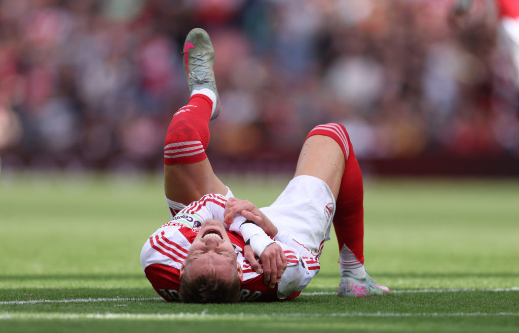 Martin Odegaard goes down injured during Arsenal v Nottingham Forest in the Premier League clash.