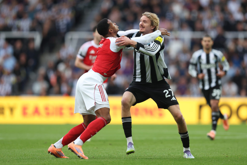 Gabriel Magalhaes and Nick Woltemade challenge each other during Newcastle United vs Arsenal