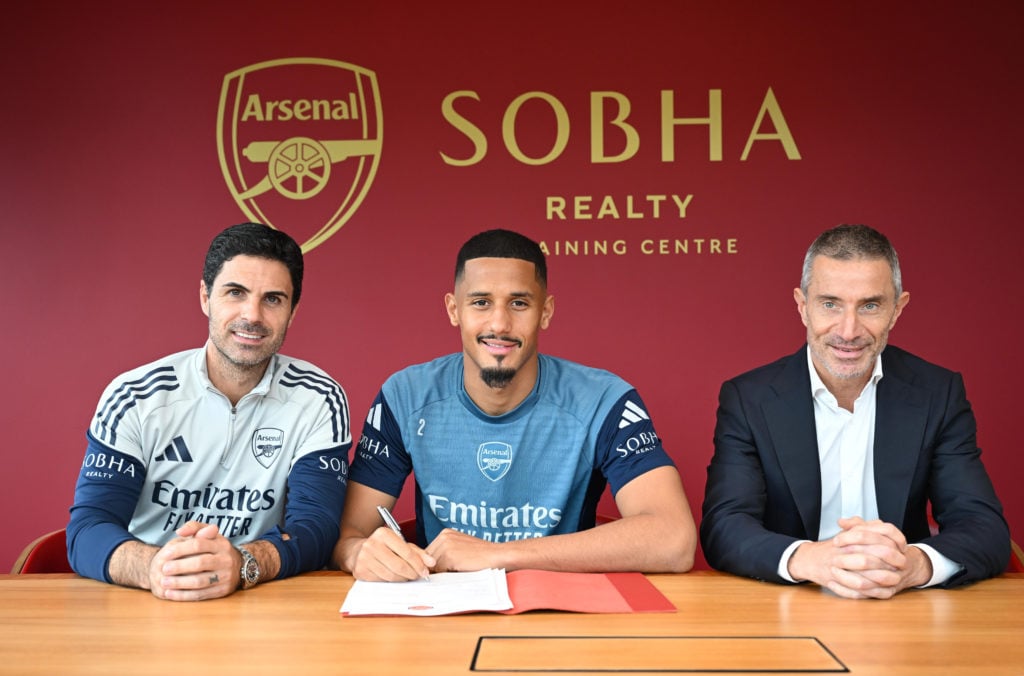 William Saliba with manager Mikel Arteta and Sporting Director Andrea Berta as he signs a contract extension at Arsenal