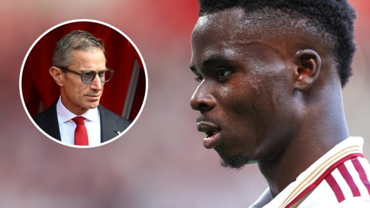 An image featuring Bukayo Saka looking on during an Arsenal game alongside sporting director Andrea Berta