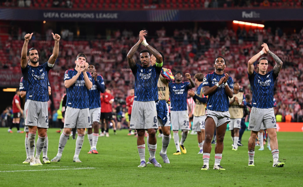 Arsenal players including Mikel Merino applaud the fans after a match