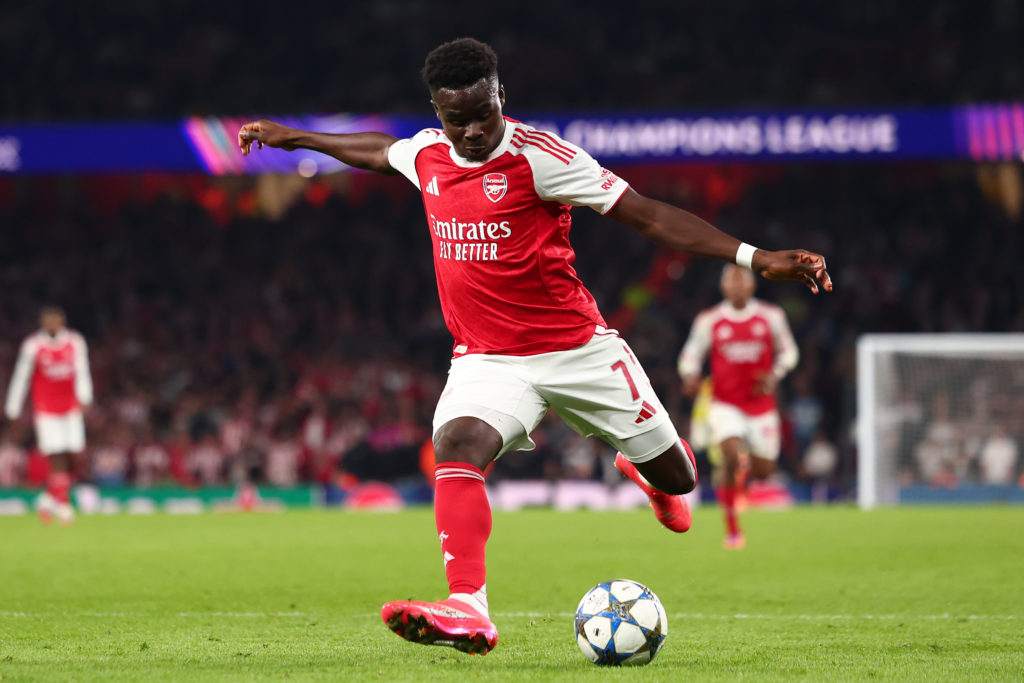 Bukayo Saka shooting the ball during an Arsenal game