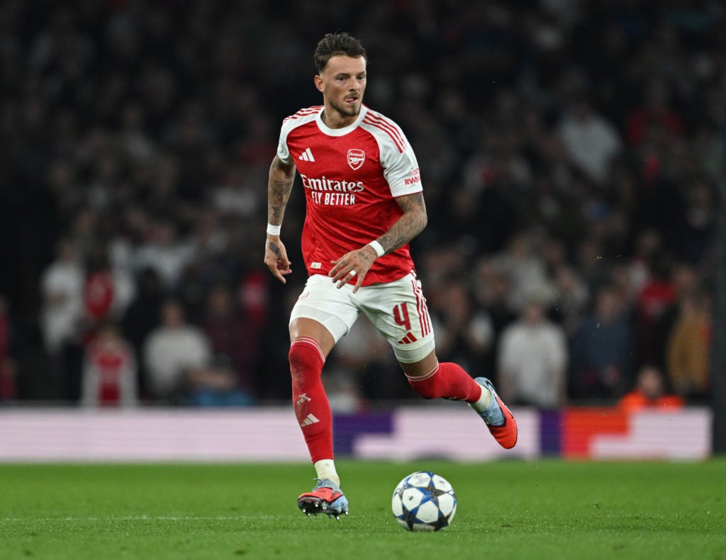 Ben White runs with the ball while playing for Arsenal against Olympiacos