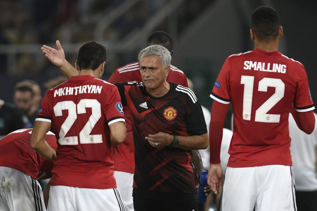 Jose Mourinho gives instructions to Henrikh Mkhitaryan during a Manchester United game