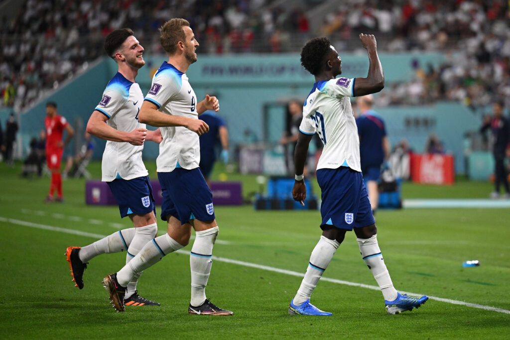 Harry Kane, Declan Rice and Bukayo Saka celebrate an England goal