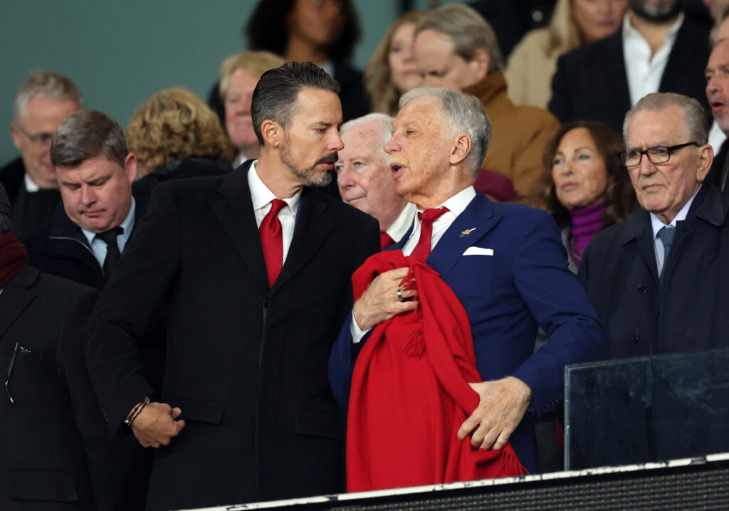 Stan Kroenke and Josh Kroenke converse in directors' box at Arsenal's Emirates Stadium