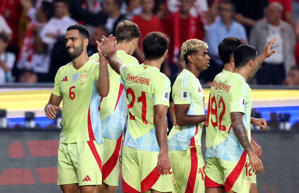 Mikel Merino of Spain celebrates scoring his team's third goal with teammate Mikel Oyarzabal.