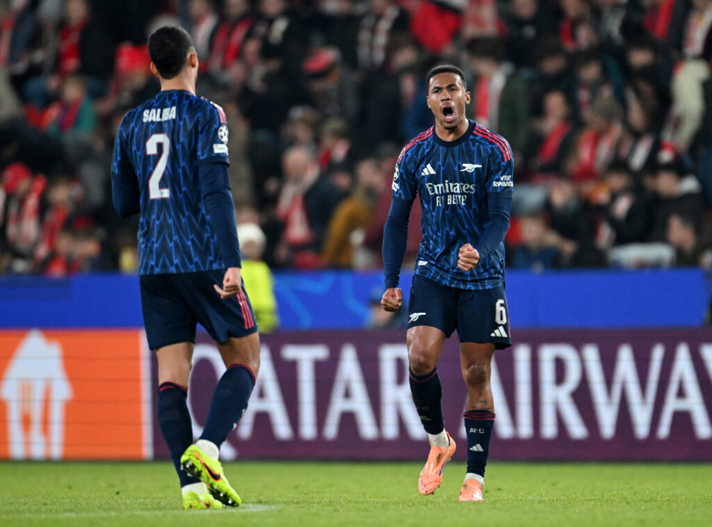 William Saliba and Gabriel Magalhaes communicate during Champions League match.