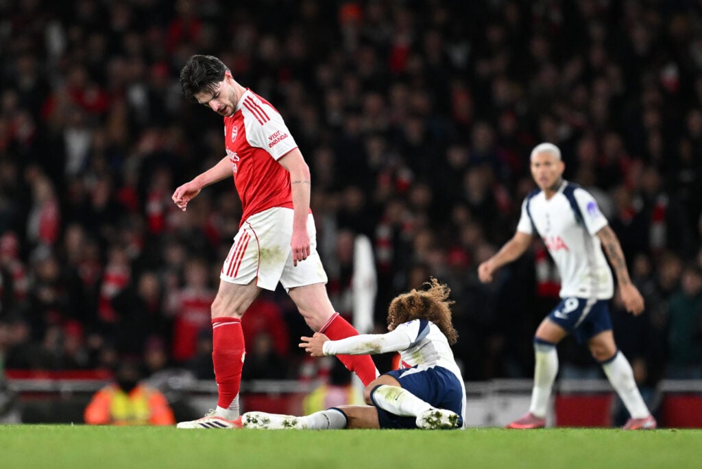 Declan Rice stands over Xavi Simons during Arsenal v Tottenham Hotspur in the Premier League.