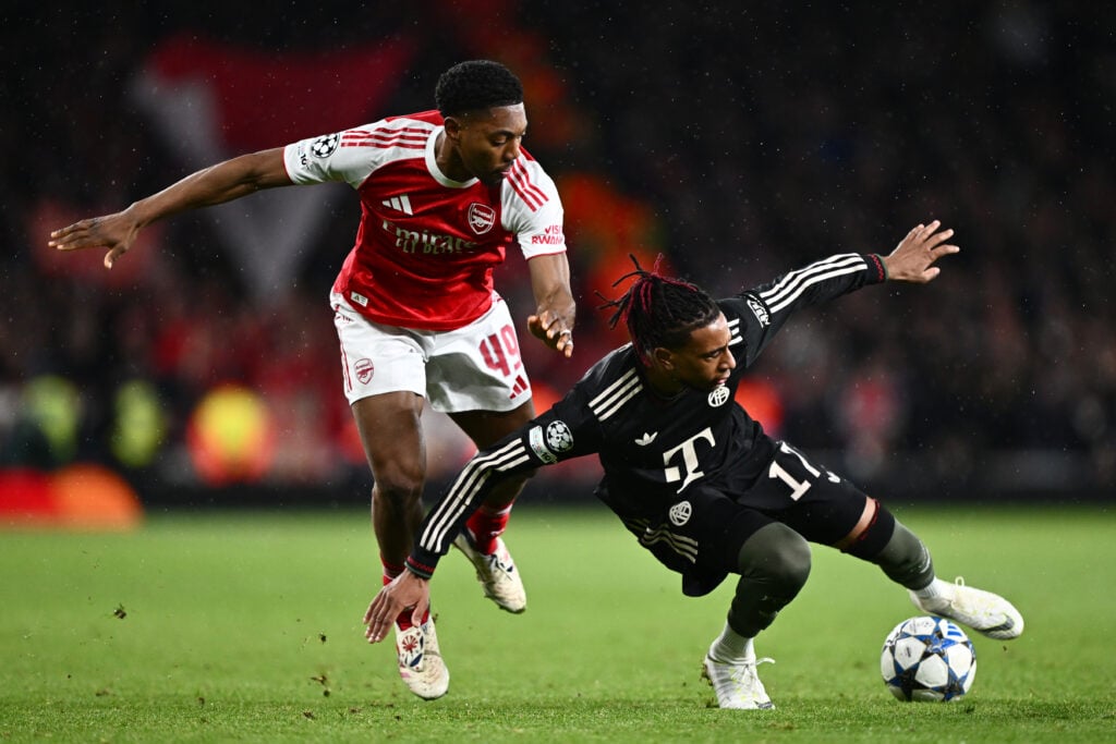 Myles Lewis-Skelly fouls Michael Olise during Arsenal v Bayern München in the UEFA Champions League.