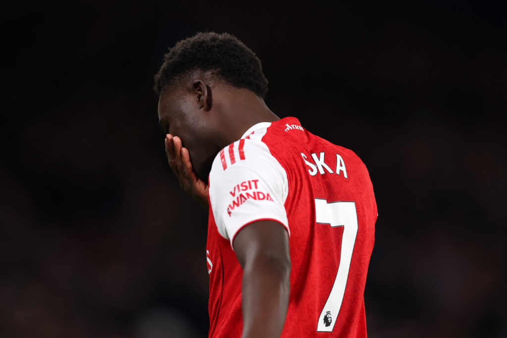 Bukayo Saka looking dejected during an Arsenal game