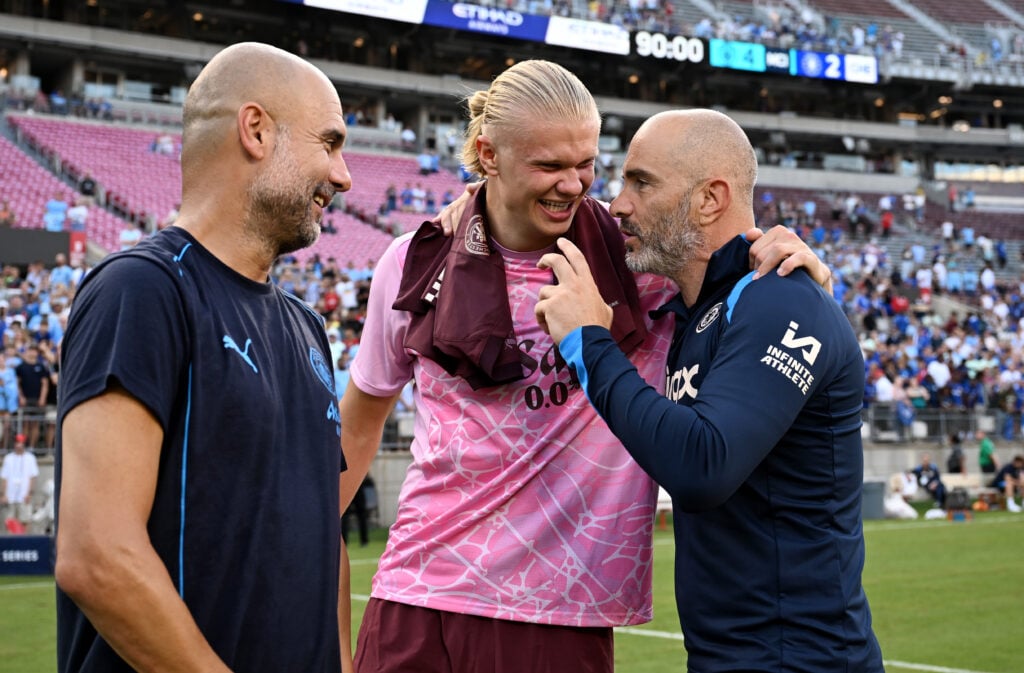 Enzo Maresca, Manager of Chelsea talks to Pep Guardiola, Manager of Manchester City and Erling Haaland of Manchester City.