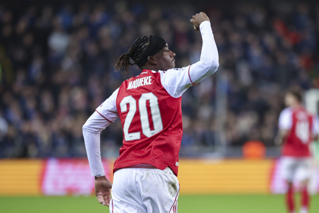 Noni Madueke celebrates after scoring for Arsenal vs Club Brugge in the Champions League