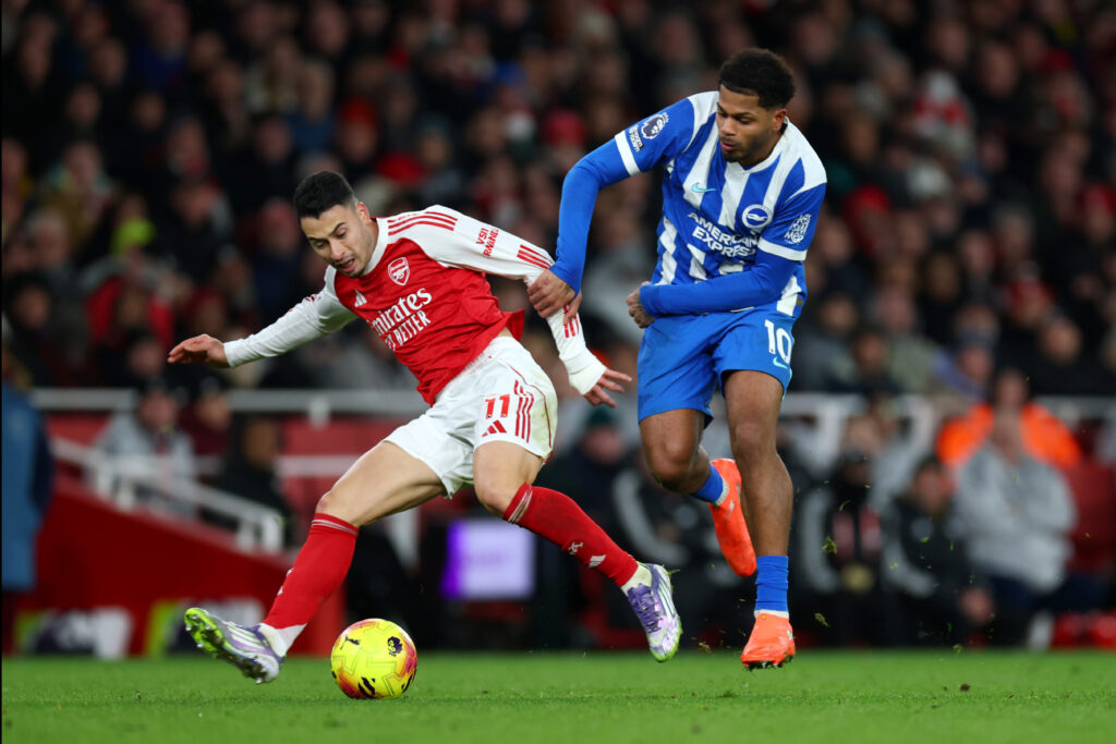Gabriel Martinelli of Arsenal is challenged by Georginio Rutter of Brighton & Hove Albion during the Premier League match