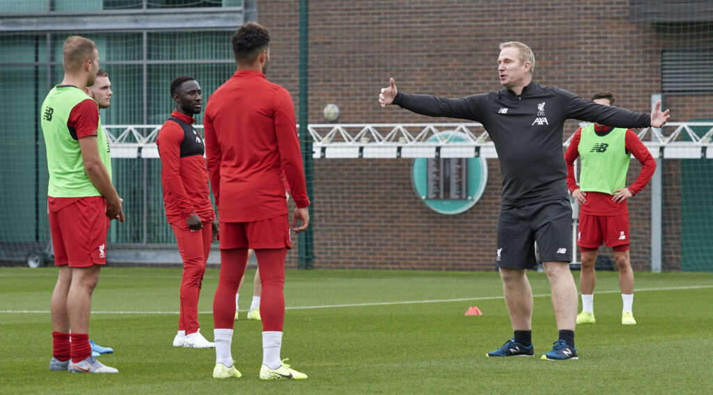 Thomas Gronnemark speaks to the players during a Liverpool training session