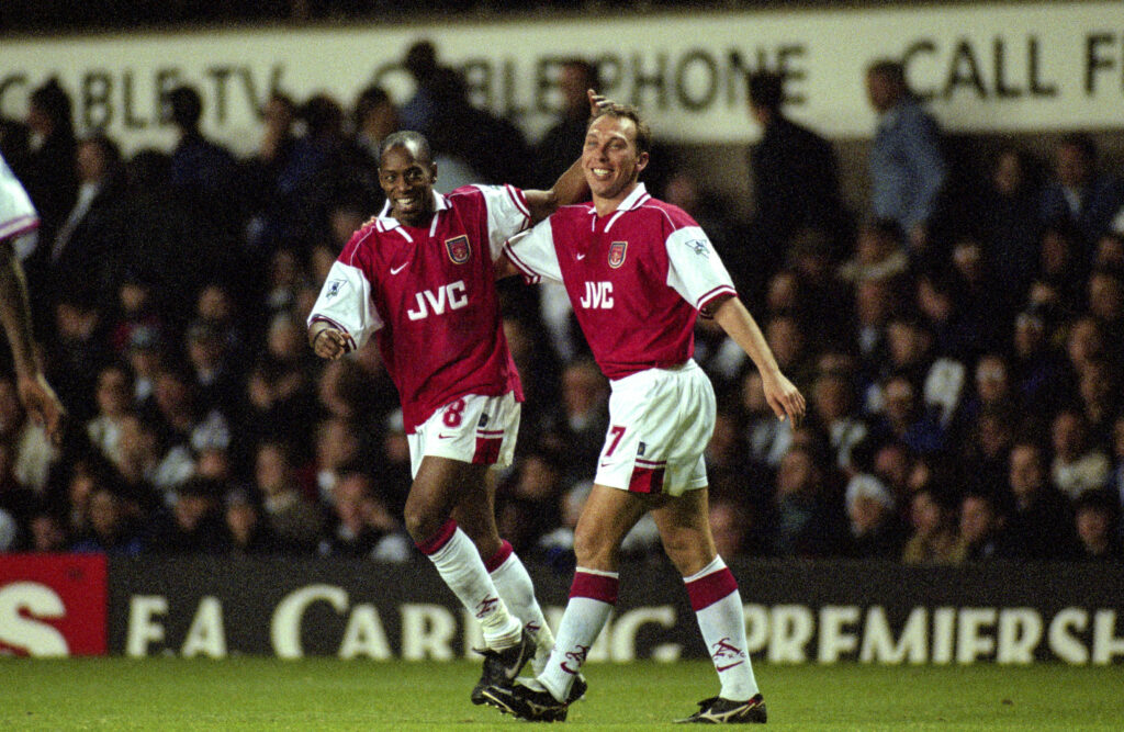 Ian Wright celebrates an Arsenal goal with David Platt