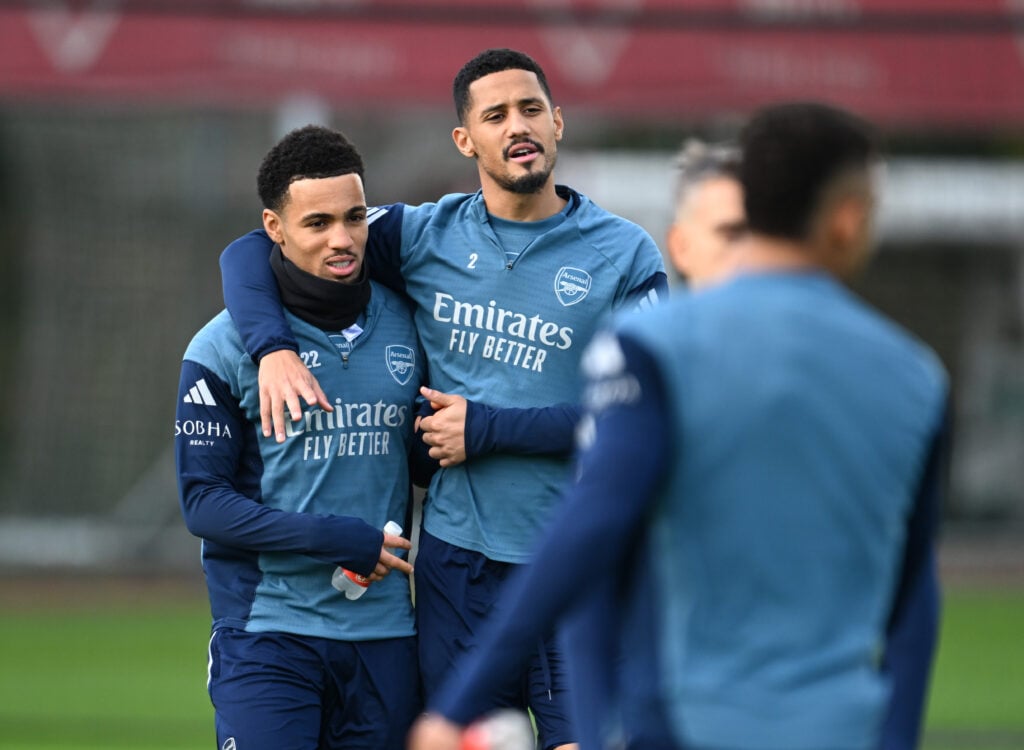 William Saliba piuts an arm around Ethan Ethan Nwaneri's shoulders during an Arsenal Training Session