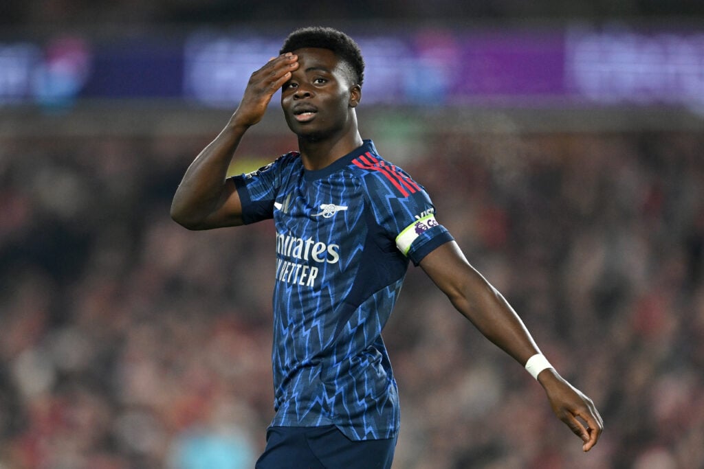 Bukayo Saka looking dejected during an Arsenal game