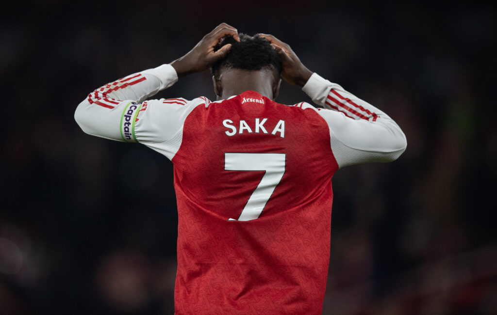 Bukayo Saka looking dejected during an Arsenal game