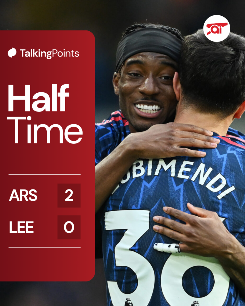 A half-time graphic from Leeds United vs Arsenal with an image of Noni Madueke embracing Martin Zubimendi after the latter's goal