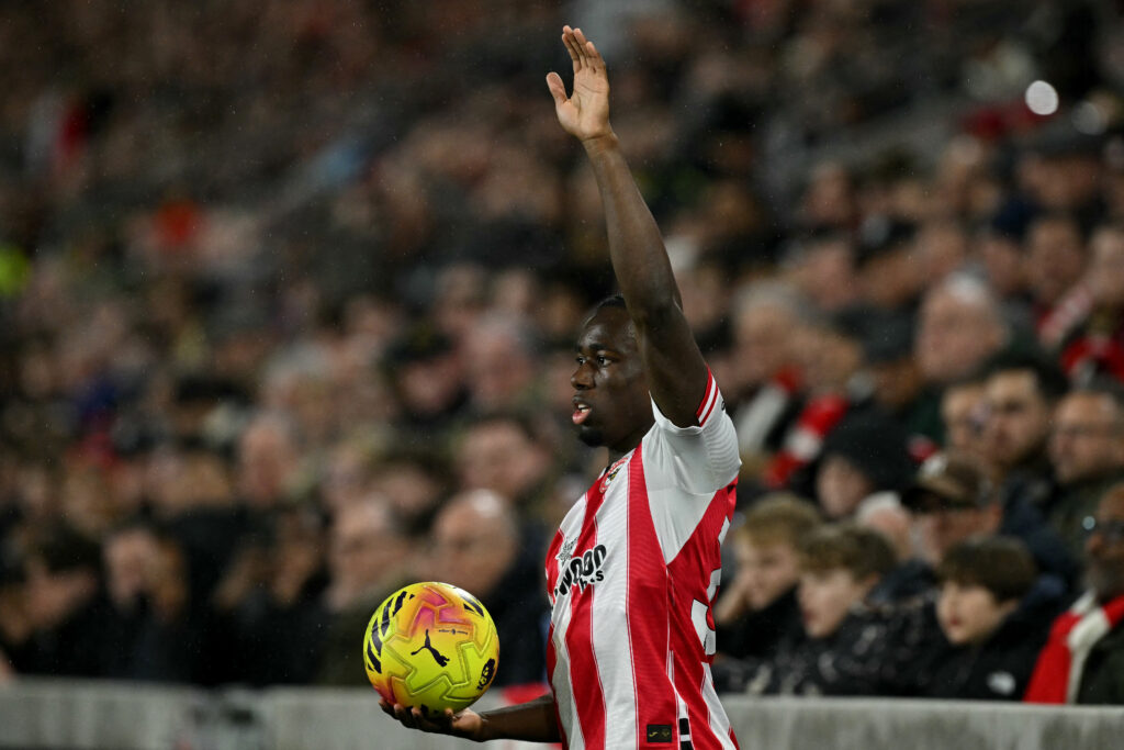 Michael Kayode of Brentford signals to his teammates before taking a long throw