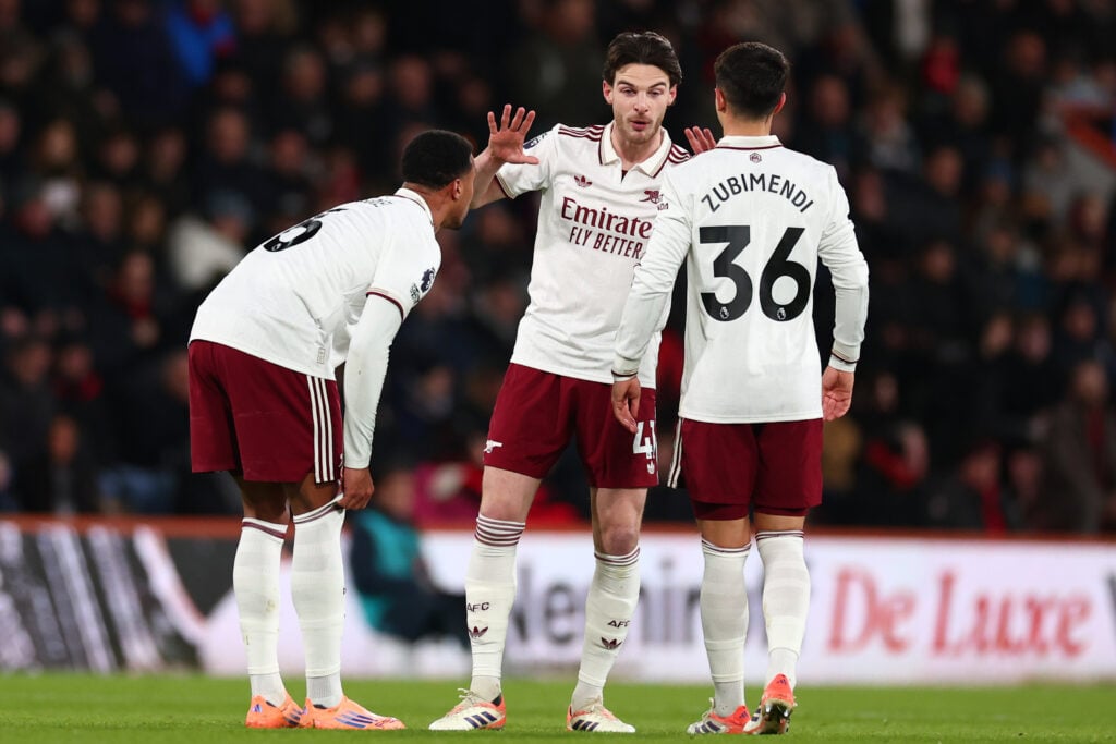 Declan Rice in discussion with Gabriel Magalhaes and Martin Zubimendi during an Arsenal game