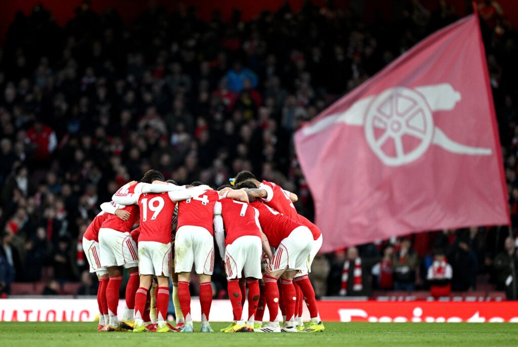 Arsenal players in a huddle before their game against Chelsea