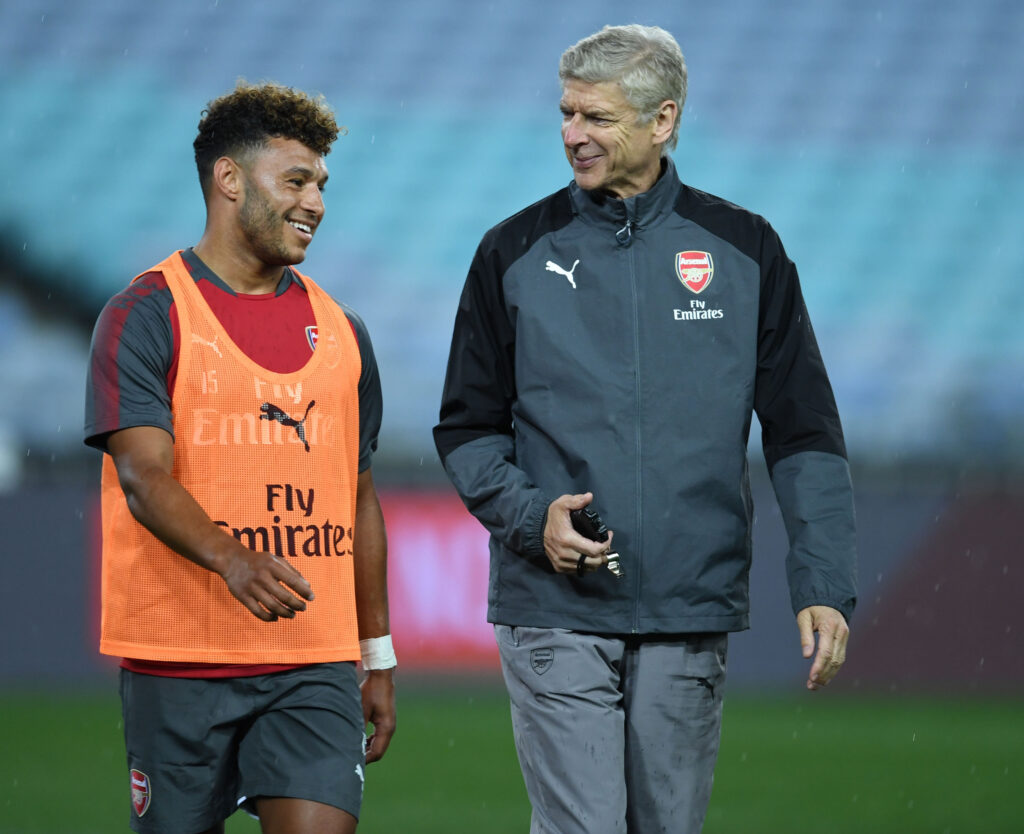 Alex Oxlade-Chamberlain and Arsene Wenger share a laugh during an Arsenal Pre-Season Tour training session