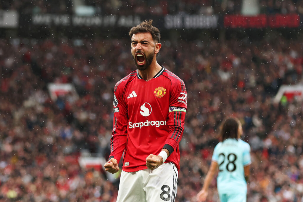 Bruno Fernandes of Manchester United celebrates after Josh Cullen of Burnley (not pictured) scores his teams own goal during the Premier League match between Manchester United and Burnley at Old Trafford.