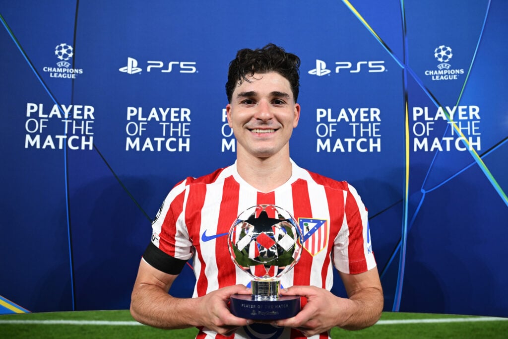 Julian Alvarez poses with the Player of the Match award after Atletico Madrid beat Barcelona