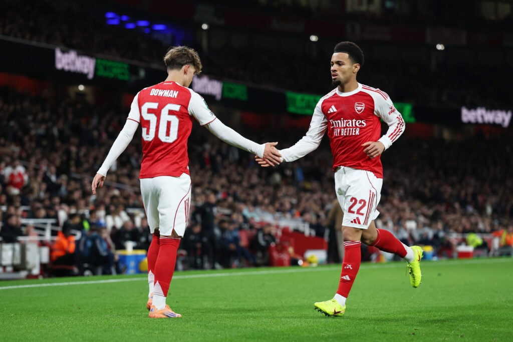 Ethan Nwaneri and Max Dowman shake hands during an Arsenal game