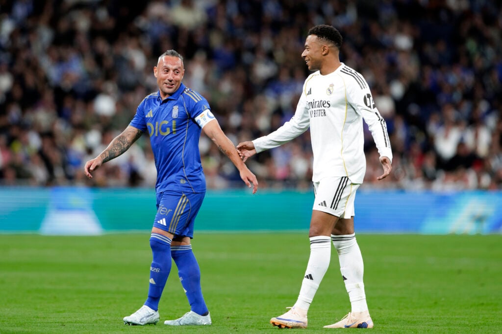 Santi Cazorla and Kylian Mbappe speak to each other during Real Madrid vs Real Oviedo